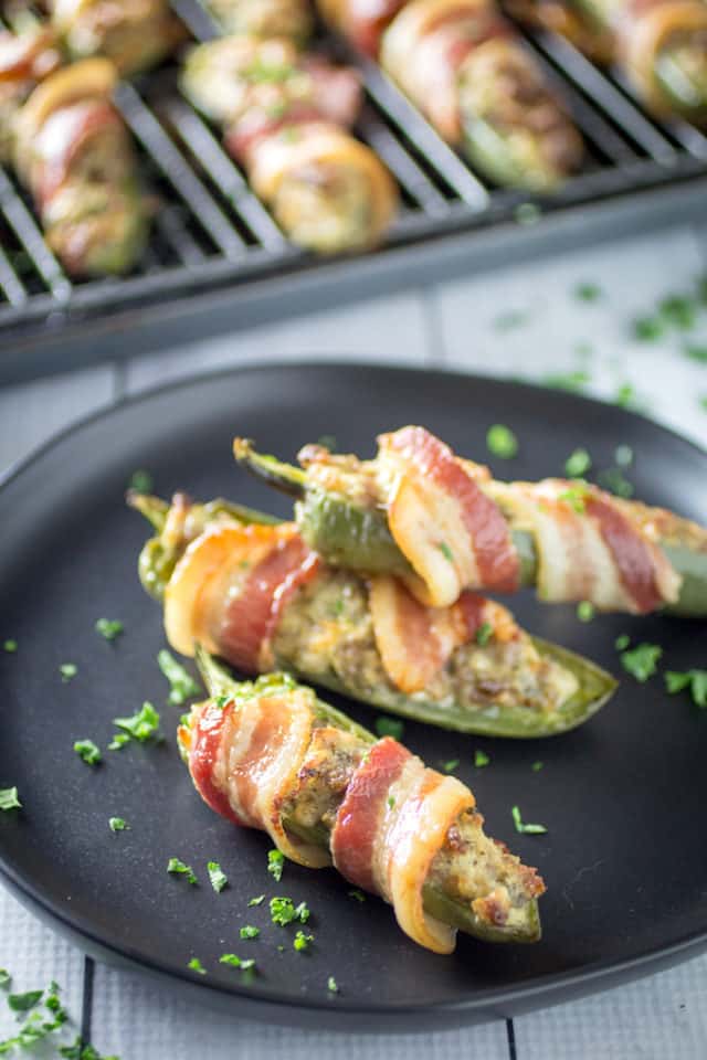 Bacon Wrapped Sausage Stuffed Jalapenos • Dishing Delish