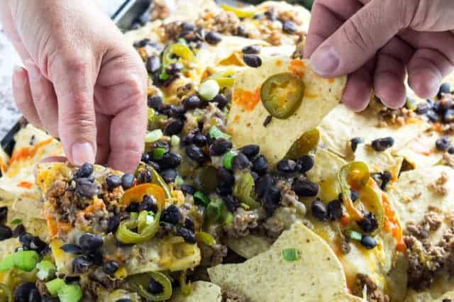 Ground Beef Nachos - Cheesy, Meaty, Spicy! • Dishing Delish