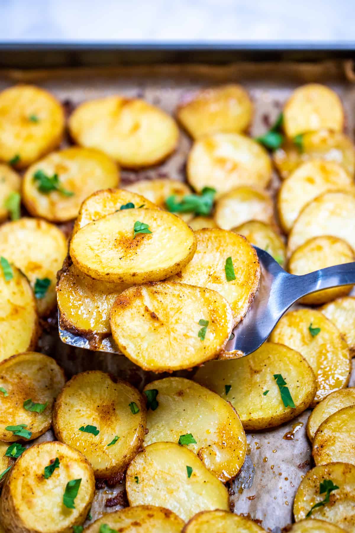 https://www.dishingdelish.com/wp-content/uploads/2023/03/Sliced-Baked-Potatoes-7.jpg