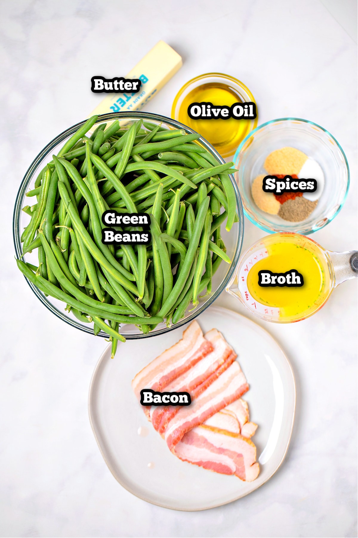Individual ingredients for crockpot green beans on a table.