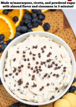 Pinterest pin with a bowl of cannoli dip topped with mini chocolate chips on a cutting board surrounded by graham crackers, vanilla wafers, blueberries, and orange slices.