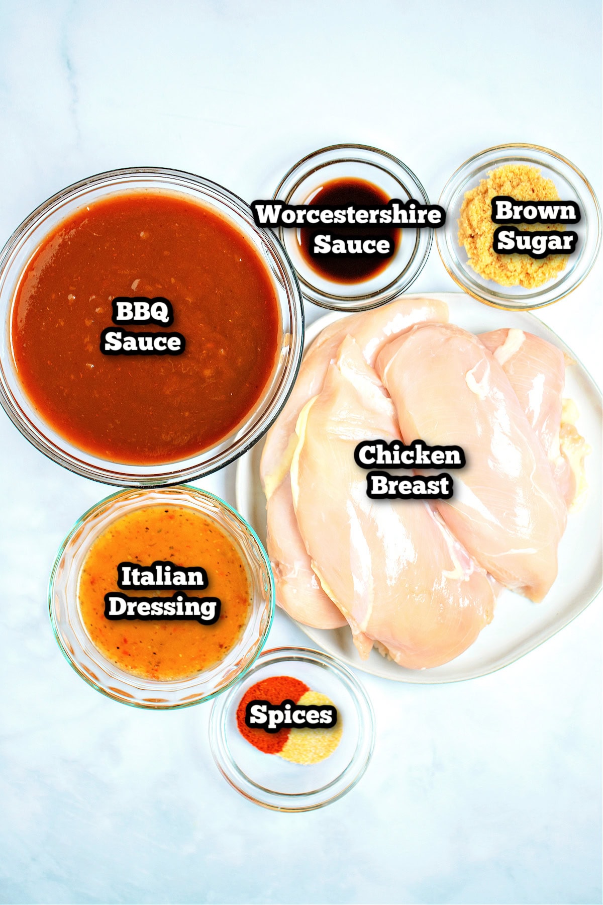 Individual ingredients for slow cooker bbq chicken on a table.