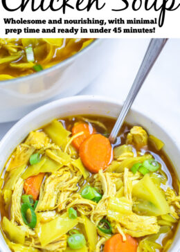 Pinterest pin with a bowl of cabbage chicken soup topped with green onions on a table with a spoon in the bowl, in front of the dutch oven of soup.