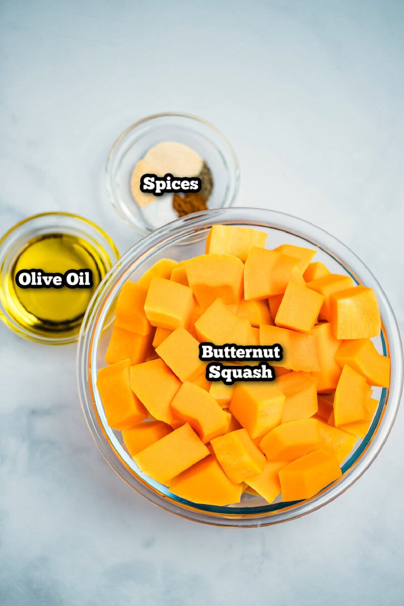 Individual ingredients for butternut squash on a table.