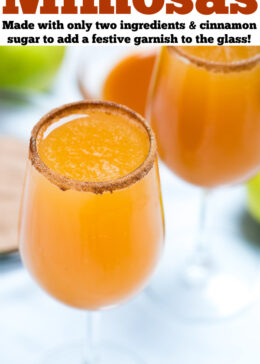 Pinterest pin with a wine glass filled with apple cider mimosas, with another wine glass and a small bowl of caramel on a table in the background.