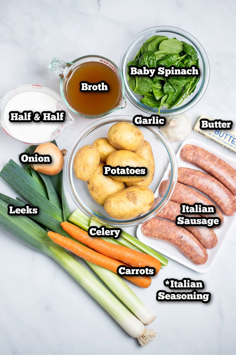 Individual ingredients for sausage potato soup on a table.