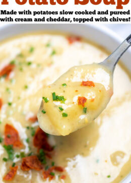 Pinterest pin with a bowl of slow cooker potato soup topped with chives and crispy bacon, with a spoon lifting up some soup.