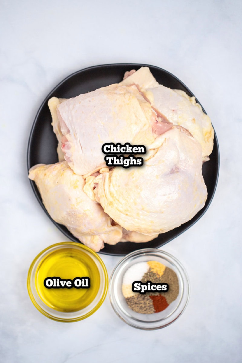 Individual ingredients for Air Fryer Chicken Thighs on a table.