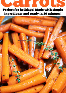 Pinterest pin with a skillet with cooked maple glazed carrots with fresh thyme sprigs on top.