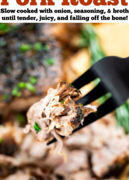 Pinterest pin with a fork holding up a piece of pork roast, with a slow cooker pork roast in the background on a cutting board.