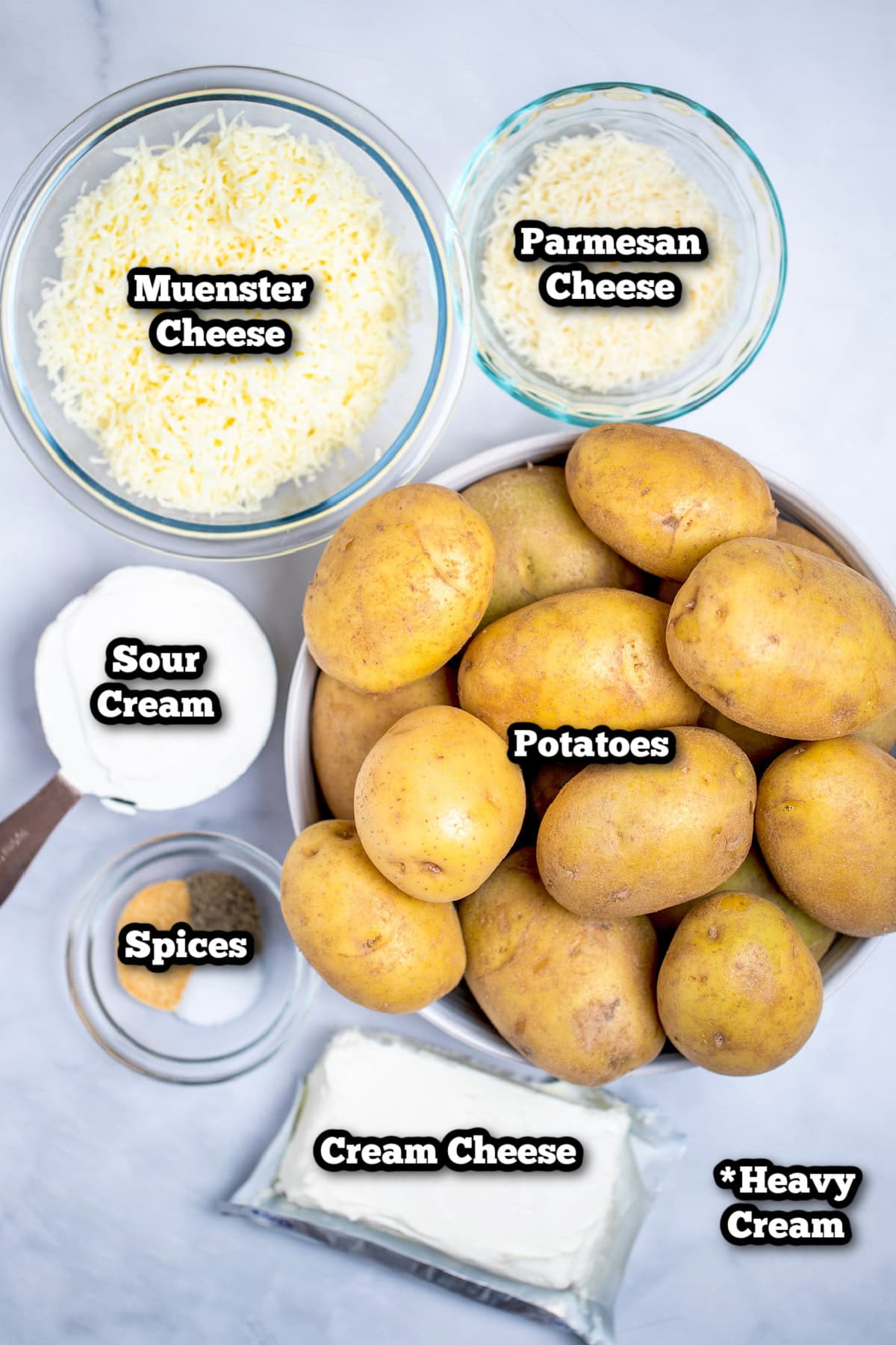 Individual ingredients for twice baked mashed potatoes on a table.