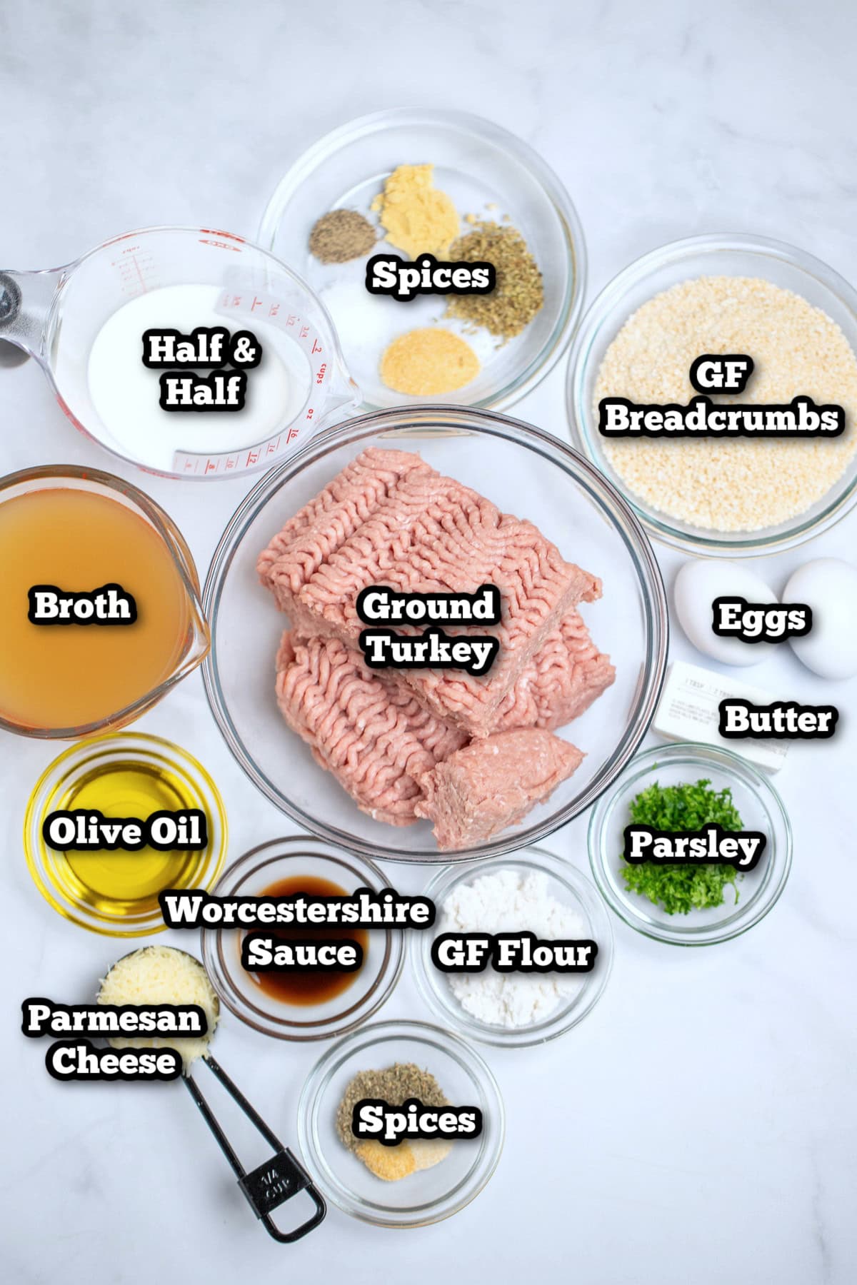 Individual ingredients for meatballs and gravy on a table.