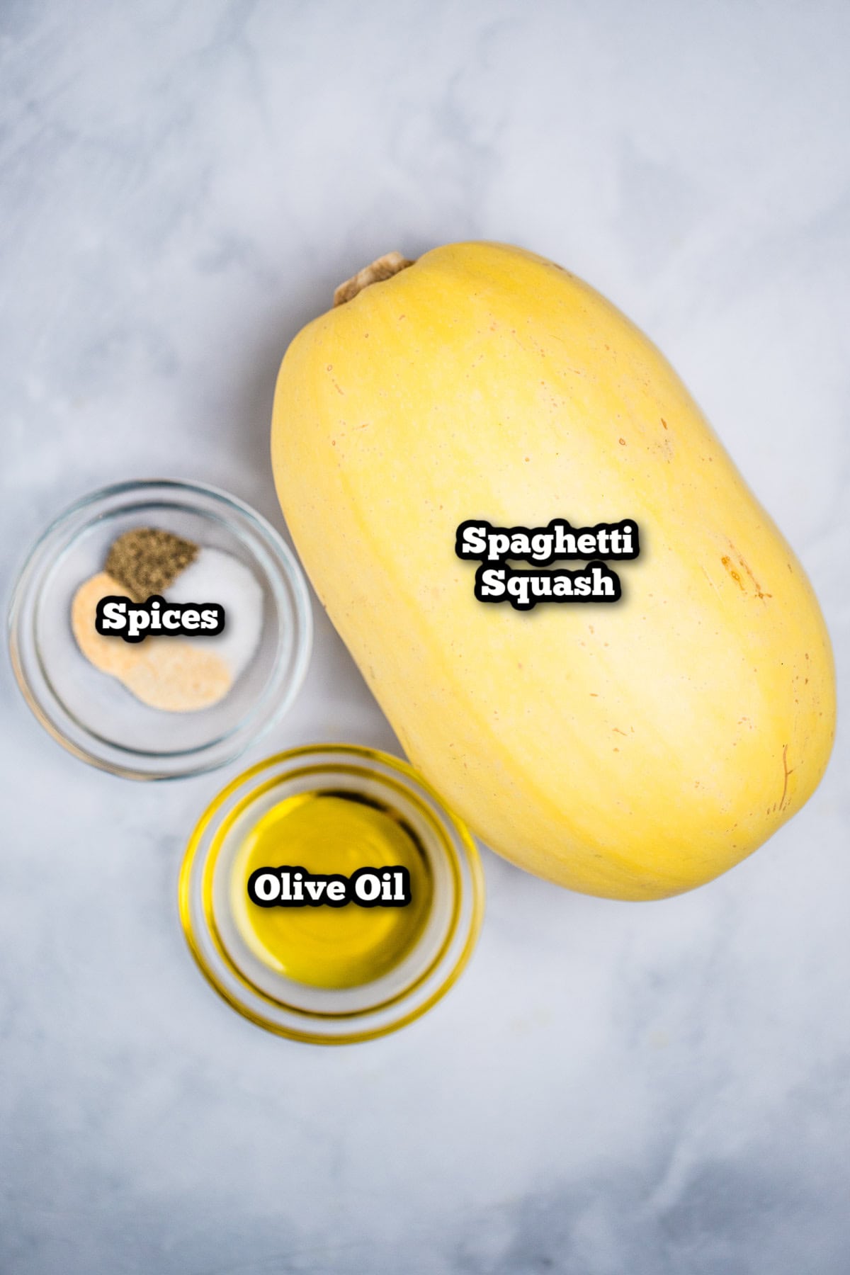 Individual ingredients with roasted spaghetti squash on a table.