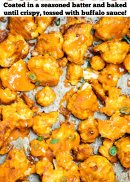 Pinterest pin with Buffalo Cauliflower Wings on a sheet pan lined with parchment paper, in a single layer, topped with extra buffalo sauce and green onions.